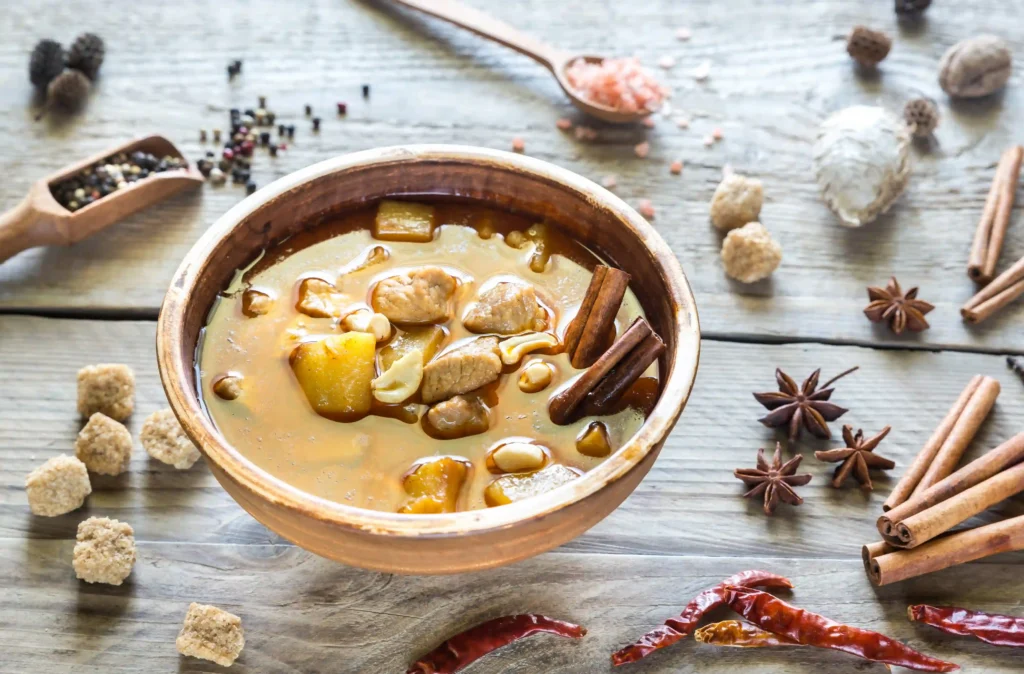 Bowl of Massaman curry with Spices and Herbs