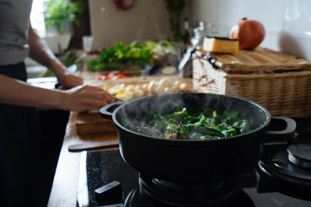 Someone cooking Pad Kra Pao in a home kitchen.