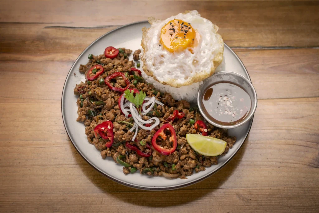 A premium restaurant-style presentation of Pad Kra Pao.