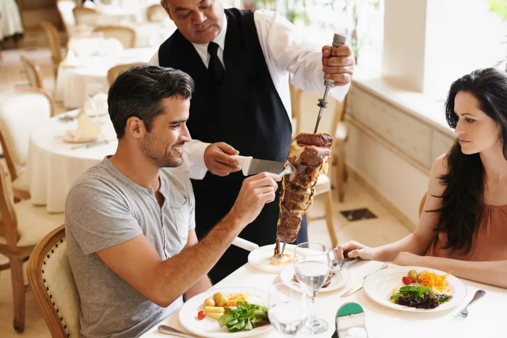 Couple enjoying Meat Skewer at the restaurant