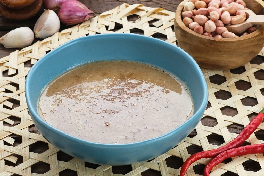 delicious peanut sauce served with spices and chilies