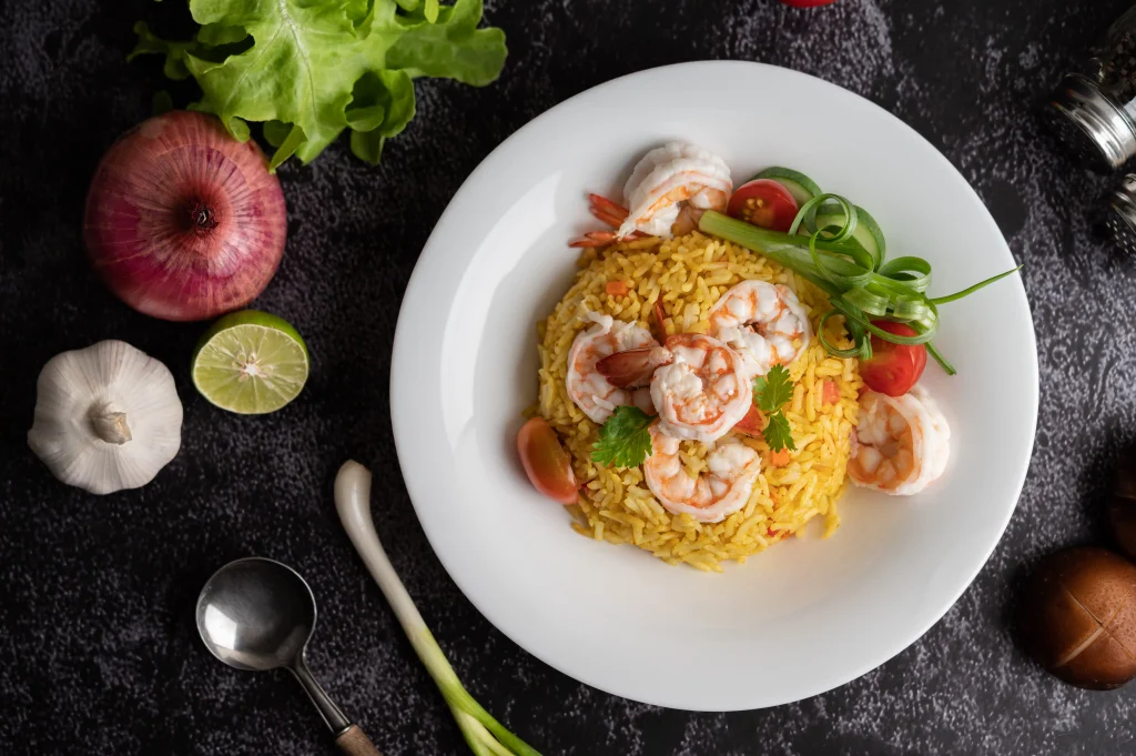 Fried Rice dish with shrimp, tomatoes and onions
